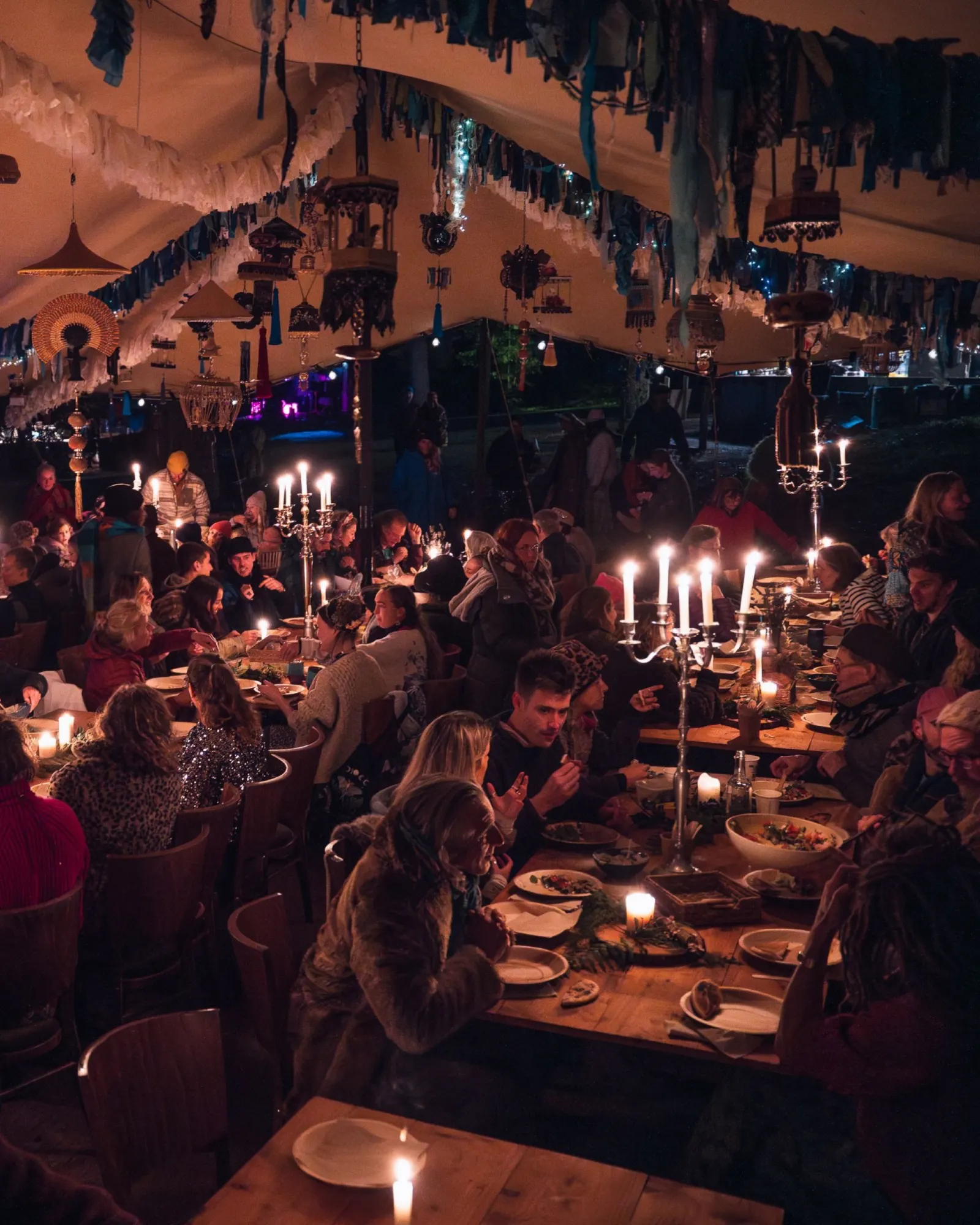 Candlelit banquet under canvas